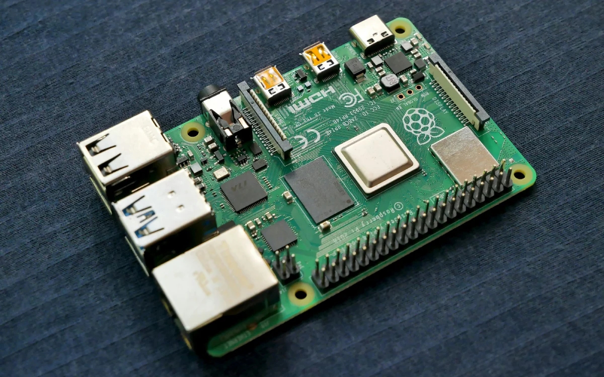 A close view of a Raspberry Pi 4 computer, a small chip with various inputs and outputs.